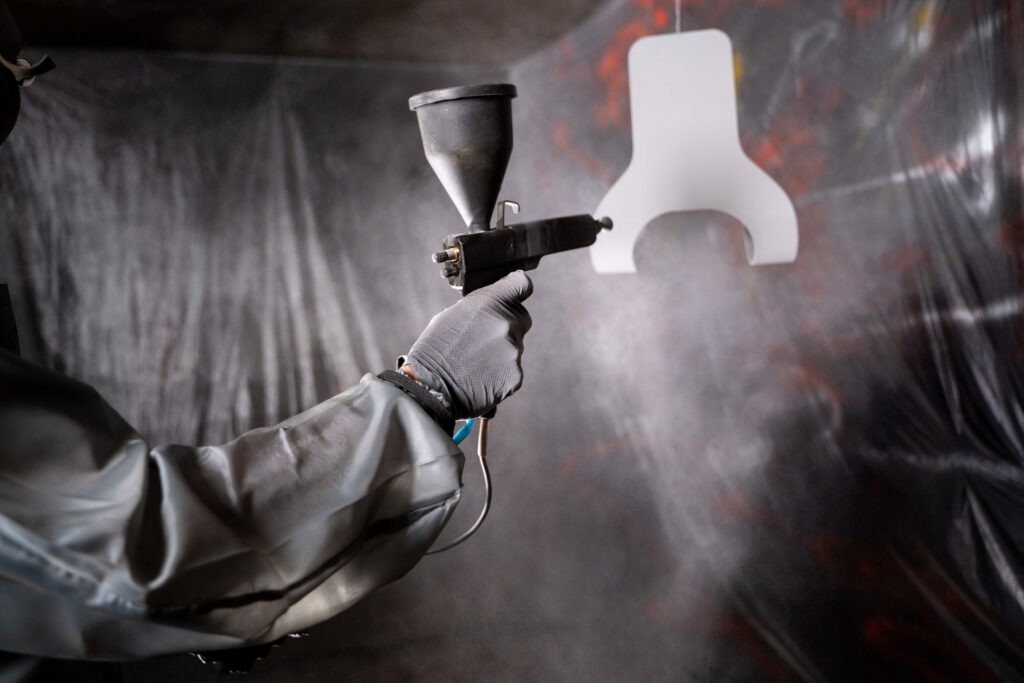 side-view-man-working-with-paint-gun-7727823