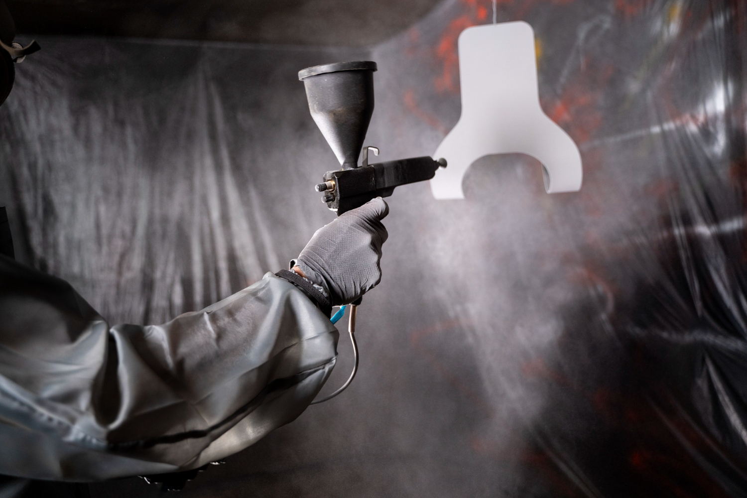 side-view-man-working-with-paint-gun-7727823