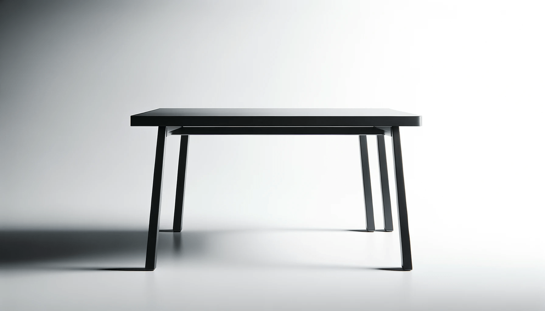 dall%c2%b7e-2023-12-19-09-03-34-a-minimalist-modern-black-desk-with-a-sleek-design-standing-on-a-white-floor-against-a-white-background-the-desk-has-a-rectangular-tabletop-with-sha-5540098