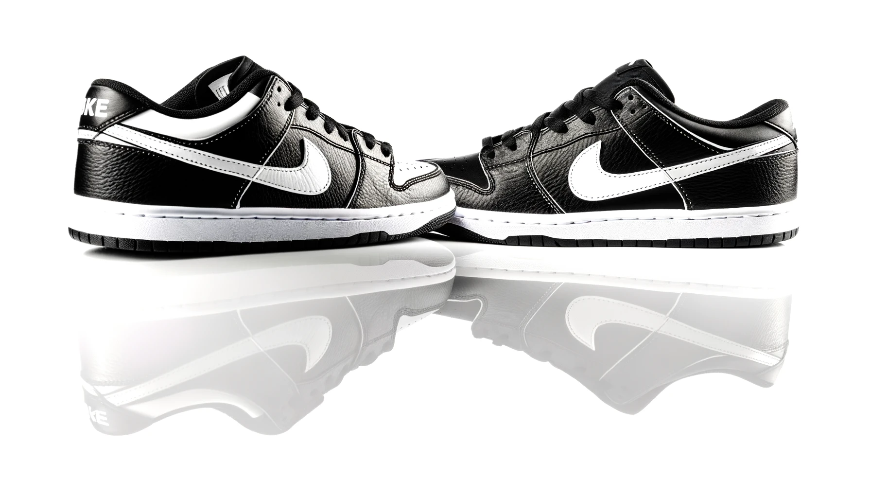 dall%c2%b7e-2024-02-17-21-09-41-a-pair-of-black-and-white-low-top-sneakers-on-a-plain-white-background-the-shoes-are-placed-side-by-side-with-a-slight-overlap-facing-slightly-towar-3557151